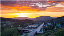 sunset behind mountains from downtown