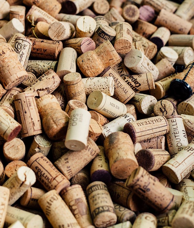 a collection of wine corks in a pile